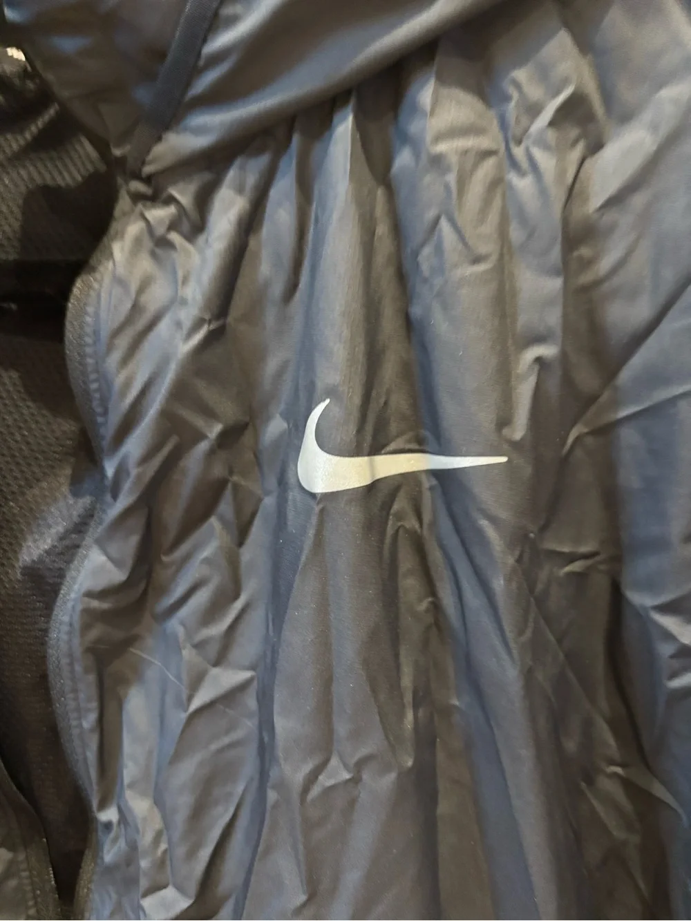 Nike Black Hooded Rain Jacket with Reflective Swoosh. Longer in back, hood.